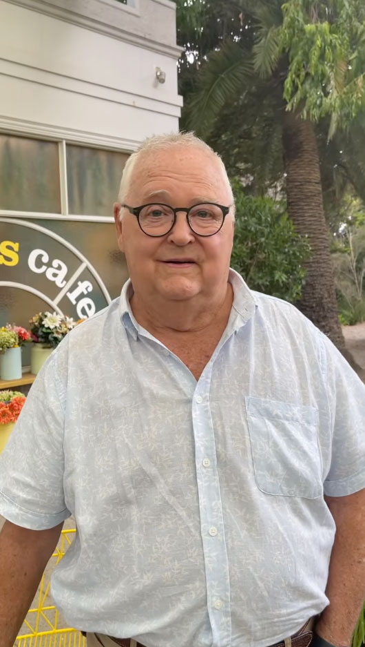 Ian Smith on the set of Neighbours, outside Harold's Cafe
